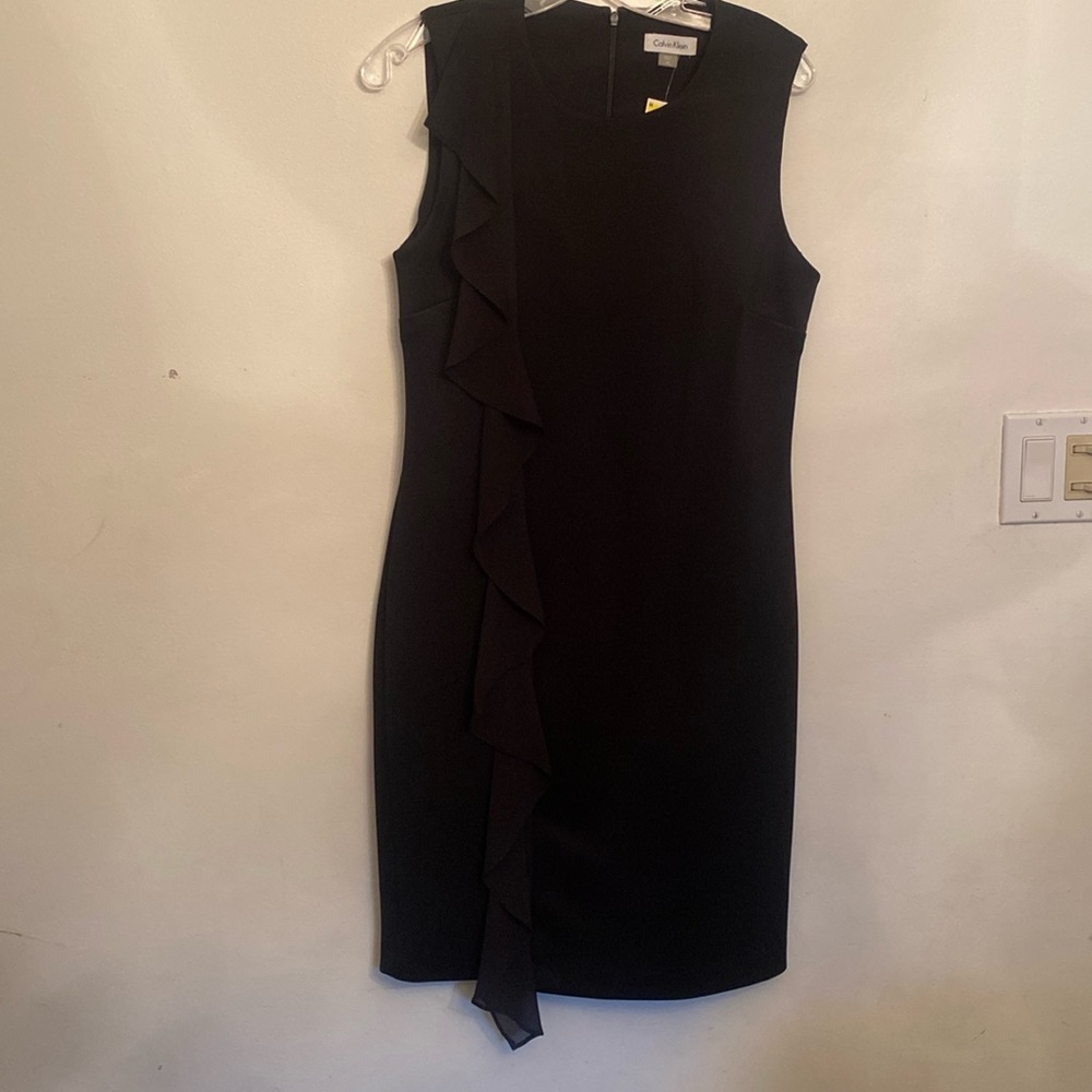 Beautiful, black, elegant ruffles on the side dress